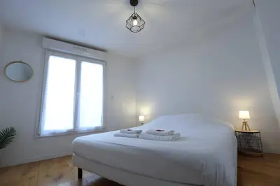 Un ou plusieurs lits dans un hébergement de l'établissement Lenoir magnifique maison 8 pers avec terrasse