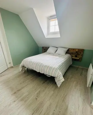 Un ou plusieurs lits dans un hébergement de l'établissement Appartement T3
