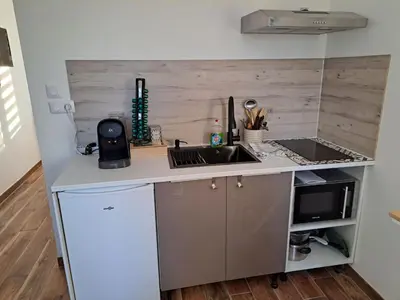 Cuisine ou kitchenette dans l'établissement chez cess