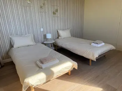Un ou plusieurs lits dans un hébergement de l'établissement Suite du Spa 2 - Parking Privé Gratuit