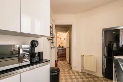 Cuisine ou kitchenette dans l'établissement L'instant Rémois