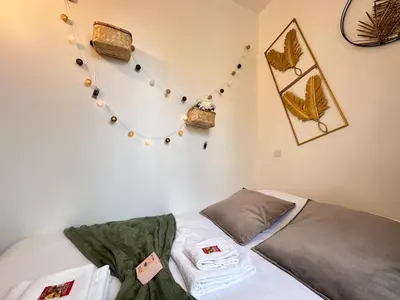 Un ou plusieurs lits dans un hébergement de l'établissement Bali 8 studio cosy proche centre ville