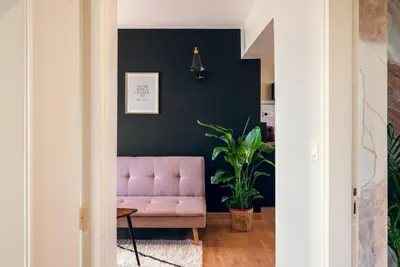 Coin salon dans l'établissement L'élegant, climatisé et rénové - Appart'hôtel Chez MV
