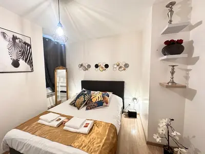 Un ou plusieurs lits dans un hébergement de l'établissement Le repère dAlice T2 cosy proche centre