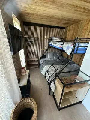 Un ou plusieurs lits dans un hébergement de l'établissement Chalet champêtre Le Doux Refuge