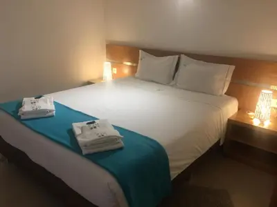 Un ou plusieurs lits dans un hébergement de l'établissement Gites Des Sablons