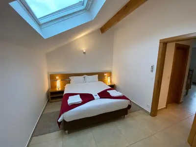Un ou plusieurs lits dans un hébergement de l'établissement Gites Des Sablons