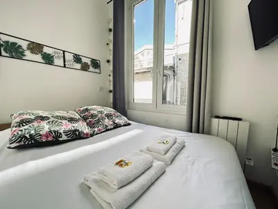 Un ou plusieurs lits dans un hébergement de l'établissement Chavalliaud 4 studio tout mignon proche centre