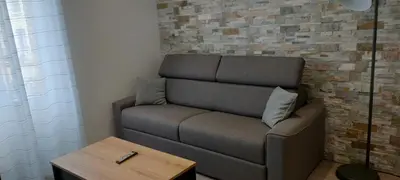 Coin salon dans l'établissement Le petit chai