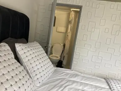 Un ou plusieurs lits dans un hébergement de l'établissement HSH France Chambre City 3 Proche de Disney
