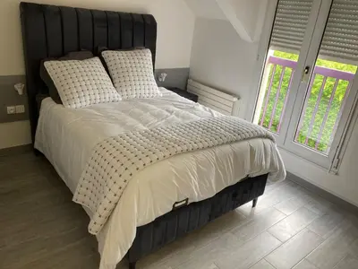 Un ou plusieurs lits dans un hébergement de l'établissement HSH France Chambre City 6 Proche de Disney