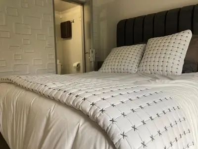 Un ou plusieurs lits dans un hébergement de l'établissement HSH France Chambre City 6 Proche de Disney