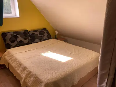 Un ou plusieurs lits dans un hébergement de l'établissement Jolie petite maison de campagne