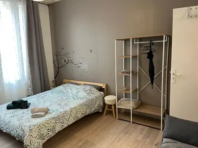Un ou plusieurs lits dans un hébergement de l'établissement Charmant studio cosy à 5 min du centre d'Épernay