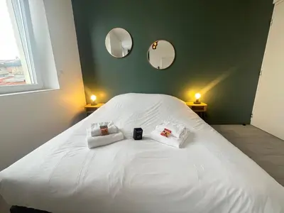 Un ou plusieurs lits dans un hébergement de l'établissement Neufchâtel studio cosy calme proche centre ville
