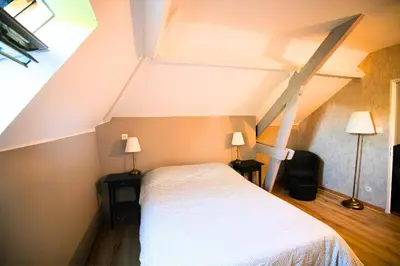 Un ou plusieurs lits dans un hébergement de l'établissement Casa Duplex Hirson