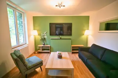 Télévision ou salle de divertissement dans l'établissement Casa Duplex Hirson