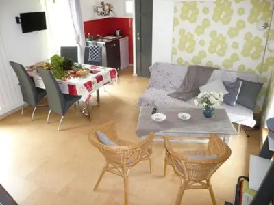 Télévision ou salle de divertissement dans l'établissement Gîte à la ferme