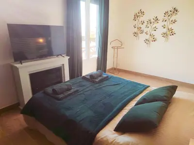 Un ou plusieurs lits dans un hébergement de l'établissement Le Chalet Tropical
