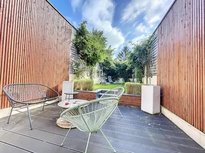 Balcon ou terrasse dans l'établissement Maison de ville avec Jardin