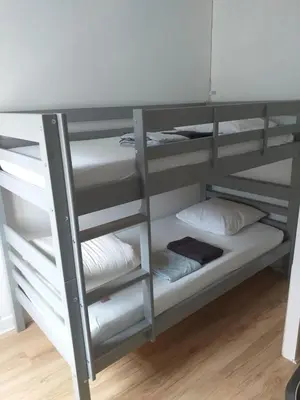 Un ou plusieurs lits dans un hébergement de l'établissement Tres bel appartement face au Chateau 2 ch 4 pers - BAUDELAIRE