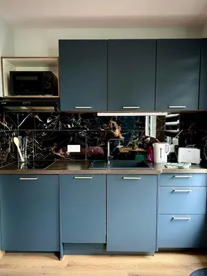 Cuisine ou kitchenette dans l'établissement Escale de la râperie logement 1