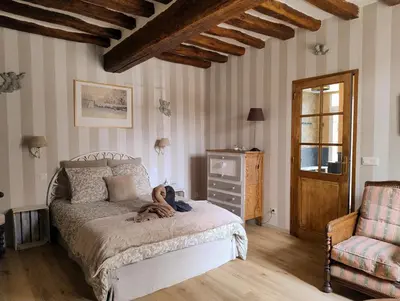 Un ou plusieurs lits dans un hébergement de l'établissement La chambre de Perrine