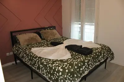 Un ou plusieurs lits dans un hébergement de l'établissement Très bel appartement - Meaux - proche Disneyland