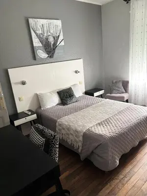 Un ou plusieurs lits dans un hébergement de l'établissement Hôtel Le Pont de l'Aube