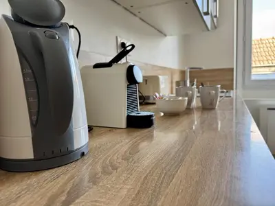 Cuisine ou kitchenette dans l'établissement Le Royal Eight Cœur de Reims