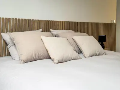 Un ou plusieurs lits dans un hébergement de l'établissement Nuit insolite Lovescape - Sauna & Spa privatif