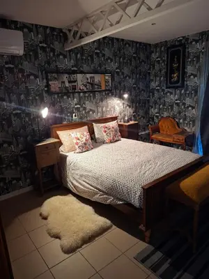 Un ou plusieurs lits dans un hébergement de l'établissement Maison spacieuse et calme