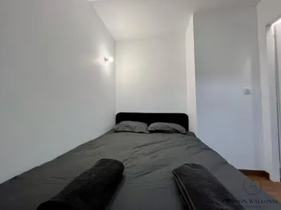 Un ou plusieurs lits dans un hébergement de l'établissement Le nid Rémois -Pied à terre en champagne