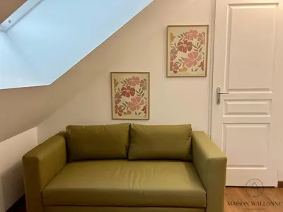 Coin salon dans l'établissement Le nid Rémois -Pied à terre en champagne