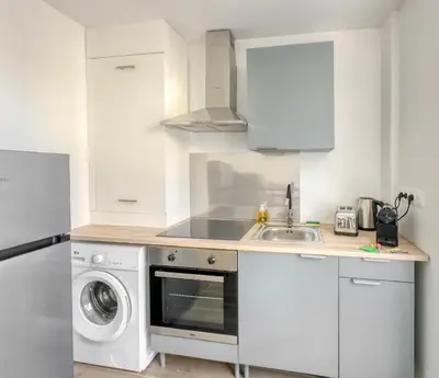 Cuisine ou kitchenette dans l'établissement Le City Chic
