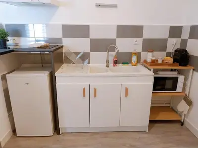 Cuisine ou kitchenette dans l'établissement Adresse cachée
