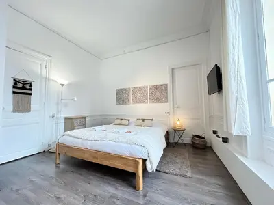 Un ou plusieurs lits dans un hébergement de l'établissement Le cœur de Reims magnifique 3 chambres au centre