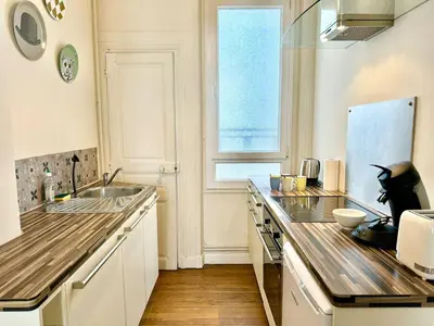 Cuisine ou kitchenette dans l'établissement Appartement Colbert