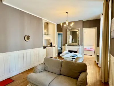 Coin salon dans l'établissement Appartement Colbert