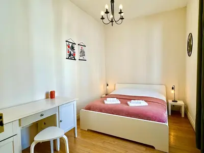 Un ou plusieurs lits dans un hébergement de l'établissement Appartement Colbert