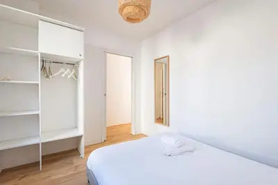 Un ou plusieurs lits dans un hébergement de l'établissement Moderne appartement 4 pers
