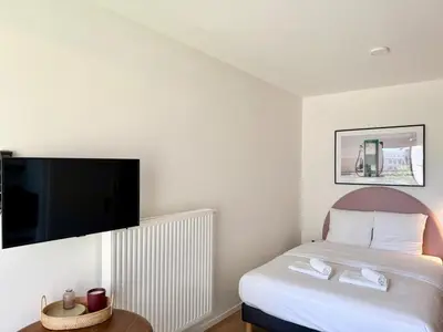Un ou plusieurs lits dans un hébergement de l'établissement We Live Inn Sharies Reims - C403