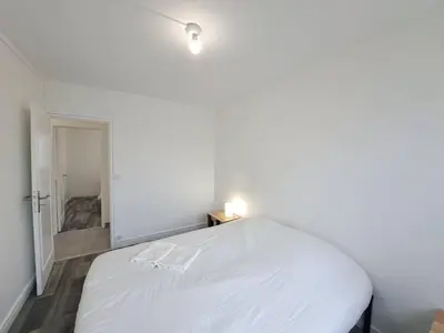 Un ou plusieurs lits dans un hébergement de l'établissement Sofia - grand appartement convivial