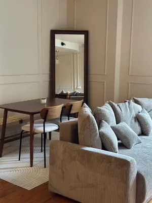 Coin salon dans l'établissement L appartement de Jeanne