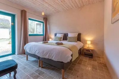 Un ou plusieurs lits dans un hébergement de l'établissement Aux hirondelles du Chêne, Maison Ecureuil