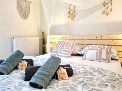Un ou plusieurs lits dans un hébergement de l'établissement Triplex bohème près du Château à Sedan, idéal 2 couples, ONLY ADULTS