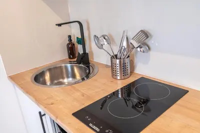 Cuisine ou kitchenette dans l'établissement Casa 159 - SAINT QUENTIN
