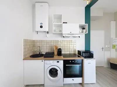 Cuisine ou kitchenette dans l'établissement La Capsule - Centre - Terrasse