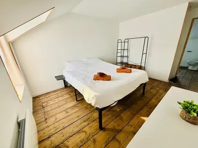 Un ou plusieurs lits dans un hébergement de l'établissement Chaleureuse maison au coeur de l'Avesnois