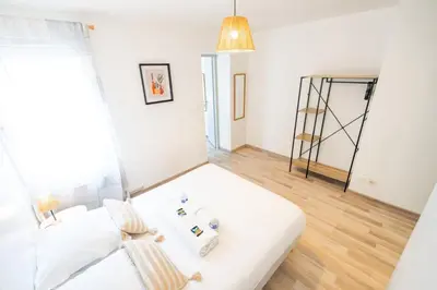 Un ou plusieurs lits dans un hébergement de l'établissement Appartement Cocoon Chalons Centre